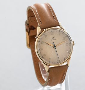 OMEGA - Orologio in oro 14k con anse riportate, quadrante champagne fan� con cifre Arabe, secondi centrali carica manuale  - Asta Orologi da Polso e da Tasca - Associazione Nazionale - Case d'Asta italiane