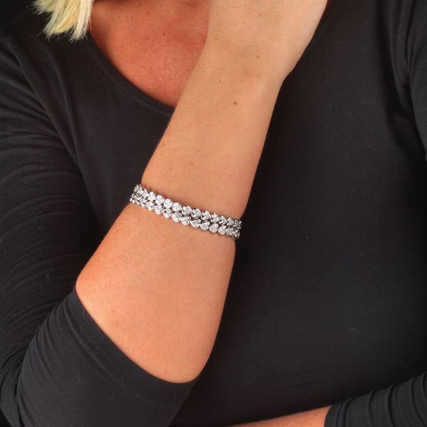 BRACCIALE A FASCIA CON CUORICINI DI DIAMANTI  - Asta Gioielli - Associazione Nazionale - Case d'Asta italiane