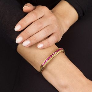 BRACCIALE RIGIDO CON RUBINI SINTETICI  - Asta Gioielli - Associazione Nazionale - Case d'Asta italiane