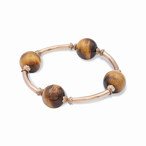 Bracciale a manetta in oro rosa 18kt e occhio di tigre  - Asta Gioielli Orologi e Fashion Vintage - Associazione Nazionale - Case d'Asta italiane