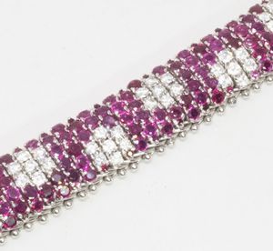 Bracciale a fascia snodata in oro bianco, con rubini e diamanti  - Asta Gioielli e Orologi - Associazione Nazionale - Case d'Asta italiane
