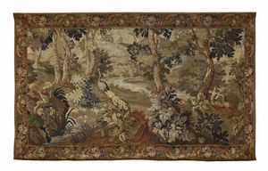 MANIFATTURA FIAMMINGA O FRANCESE DEL XVII SECOLO - Arazzo raffigurante paesaggio naturale con pavone e volatili in una foresta attraversata da un corso d'acqua, entro bordura decorata a motivi vegetali e floreali