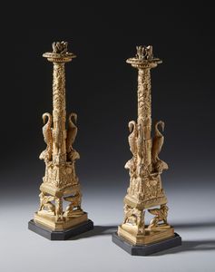 BOSCHI GIUSEPPE (1766 - 1821) - Attribuito a. Coppia di candelabri in bronzo dorato in stile piranesiano con fusto decorato a motivi fitomorfi fiancheggiato da gru poggianti su teste di ariete e base sostenuta da tre leoni alati