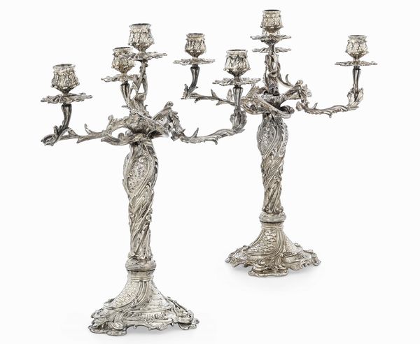 Coppia di candelabri. Argento fuso, sbalzato e cesellato. Francia XIX-XX secolo. Argentiere EB entro losanga (non identificato)  - Asta Argenti da Collezione | Antichi - Associazione Nazionale - Case d'Asta italiane
