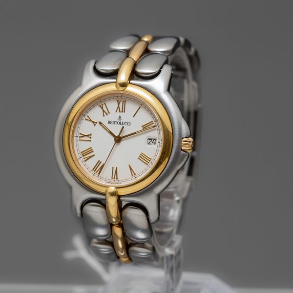 BERTOLUCCI - Pulchra , orologio acciaio e oro al quarzo con datario, quadrante bianco con numeri Romani  - Asta Orologi  - Associazione Nazionale - Case d'Asta italiane