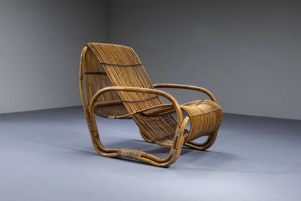 TRAVASA GIOVANNI  nello stile : Poltrona a forma geometrica con struttura in bamboo e canna d�india  legature in cuoio intrecciato. Anni '60 cm 90x70x90  - Asta Design - Associazione Nazionale - Case d'Asta italiane