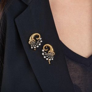 COPPIA DI SPILLE CORNUCOPIA CON DIAMANTI  - Asta Gioielli - Associazione Nazionale - Case d'Asta italiane