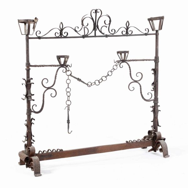 Grande alare da camino in ferro battuto  - Asta  Antiquariato gennaio | Cambi Time - Associazione Nazionale - Case d'Asta italiane