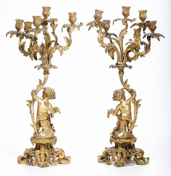 Coppia candelabri con putti in metallo dorato. XIX secolo  - Asta  Antiquariato gennaio | Cambi Time - Associazione Nazionale - Case d'Asta italiane