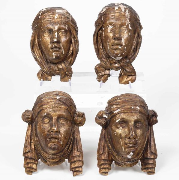 Quattro volti femminili in legno intagliato e dorato  - Asta Scultura | Cambi Time - Associazione Nazionale - Case d'Asta italiane