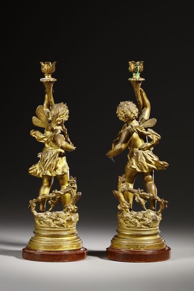 RANCOULET ERNEST (1842 - 1918) : Da un modello di. Coppia di candelabri in bronzo dorato in forma di amorini alati reggifiaccola (allegorie di Autunno e Primavera)  - Asta Asta 395 | ARTE ANTICA E DEL XIX SECOLO Online - Associazione Nazionale - Case d'Asta italiane