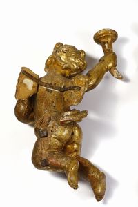 SCULTORE CENTROITALIANO DEL XVII-XVIII SECOLO : Coppia di putti alati in legno scolpito e dorato raffigurati nell'atto di reggere delle cornucopie  - Asta Asta 395 | ARTE ANTICA E DEL XIX SECOLO Online - Associazione Nazionale - Case d'Asta italiane