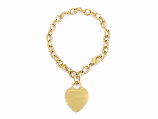 Bracciale in oro giallo con pendente Tiffany & Co in oro giallo  - Asta Gioielli e orologi - Associazione Nazionale - Case d'Asta italiane