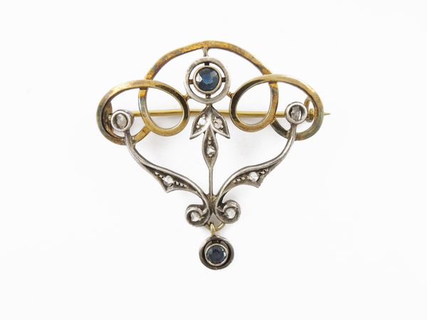 Spilla in oro giallo e argento con diamanti e zaffiri  - Asta Gioielli e orologi - Associazione Nazionale - Case d'Asta italiane