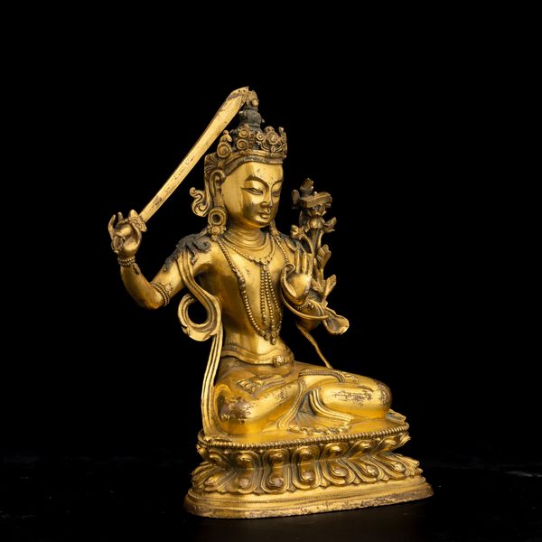 Figura di divinit� con spada in bronzo dorato, Cina, Dinastia Qing, XVIII secolo  - Asta Fine Chinese Works of Art - Associazione Nazionale - Case d'Asta italiane