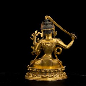 Figura di divinit� con spada in bronzo dorato, Cina, Dinastia Qing, XVIII secolo  - Asta Fine Chinese Works of Art - Associazione Nazionale - Case d'Asta italiane