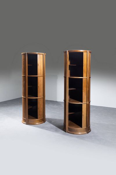 PRODUZIONE ITALIANA : Coppia di mobili contenitori in legno di noce con ante scorrevoli. Anni '70 cm 189x72  - Asta Design - Associazione Nazionale - Case d'Asta italiane