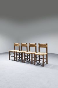 CHARLOTTE PERRIAND  nello stile di : Quattro sedie in legno  sedili e schienali in paglia.  Anni '60 cm 86x41x41  - Asta Design - Associazione Nazionale - Case d'Asta italiane