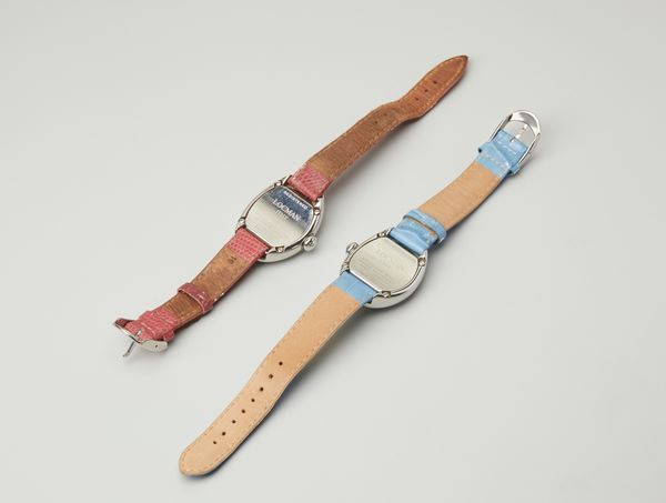 LOCMAN : Due orologi in acciaio con cassa ovale con cinturino rosso e azzurro.  - Asta Asta 402 | GIOIELLI - OROLOGI Online - Associazione Nazionale - Case d'Asta italiane