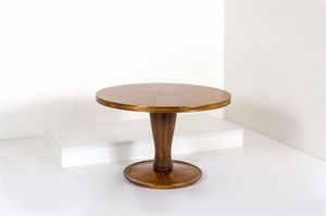 COLLI PIER LUIGI - Tavolo in legno di palissandro con sostegno centrale, piano placcato a spicchi, basamento tornito. Filettature  [..]