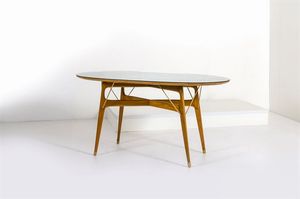 PRODUZIONE ITALIANA - Tavolo di forma ovale in legno con tiranti in ottone.Anni '50cm 78x159x84