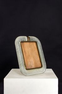 BAROVIER & TOSO - Cornice portafoto in vetro lavorato a torchon.Marchio del produttore incusso nella montatura.Anni '50cm 35x28