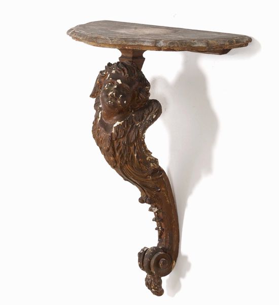 Consolle in legno intagliato con putto. Elementi antichi  - Asta Antiquariato Aprile - Associazione Nazionale - Case d'Asta italiane
