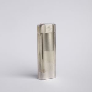 CARTIER - Accendino in metallo argentato.