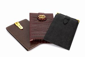 GUCCI - Lotto composta da tre porta assegni
