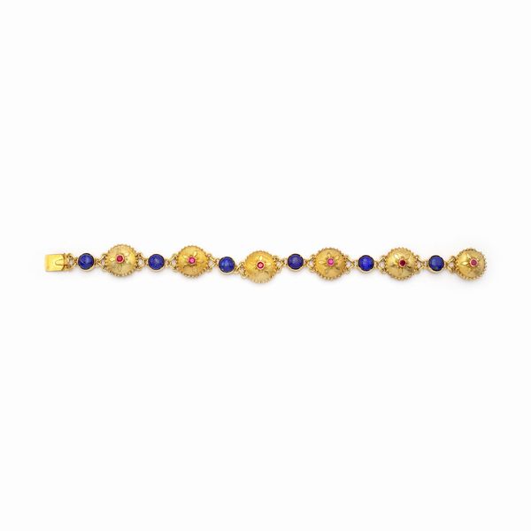 Bracciale in oro giallo 18kt rubini e lapislazzulo  - Asta Gioielli Orologi e Fashion Vintage - Associazione Nazionale - Case d'Asta italiane