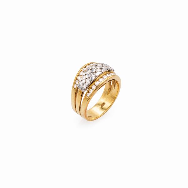 Anello in oro giallo e bianco 18kt con diamanti  - Asta Gioielli Orologi e Fashion Vintage - Associazione Nazionale - Case d'Asta italiane