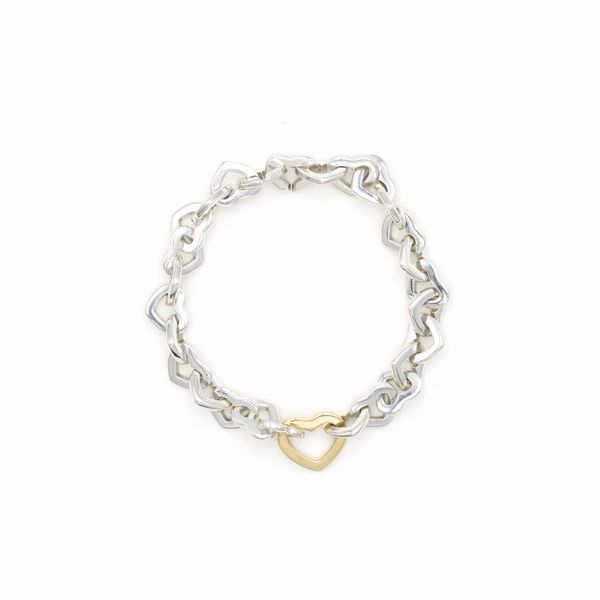 Tiffany & Co. bracciale cuori in argento e oro giallo 18kt  - Asta Gioielli Orologi e Fashion Vintage - Associazione Nazionale - Case d'Asta italiane