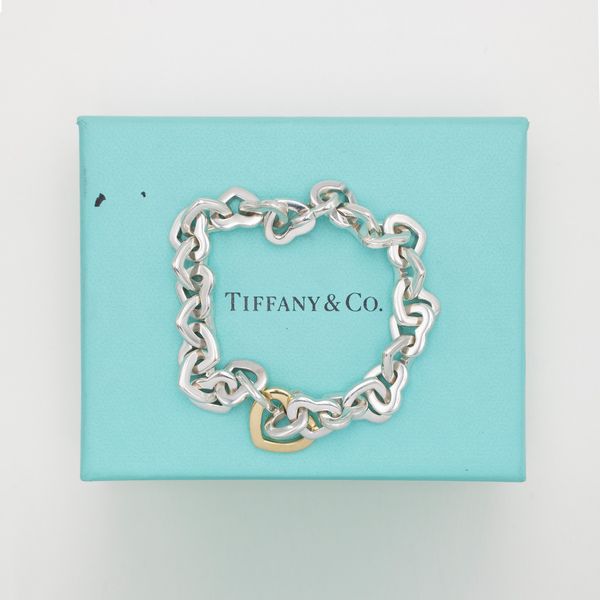 Tiffany & Co. bracciale cuori in argento e oro giallo 18kt  - Asta Gioielli Orologi e Fashion Vintage - Associazione Nazionale - Case d'Asta italiane