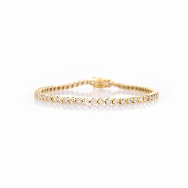 Bracciale tennis in oro giallo 18kt e diamanti  - Asta Gioielli Orologi e Fashion Vintage - Associazione Nazionale - Case d'Asta italiane