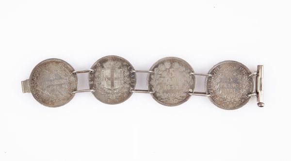 Bracciale con quattro monete in argento: 5 franchi Francia Luigi Filippo 1832 Tolosa, Terza Repubblica 1873 Parigi e 1874 Bordeaux - 5 lire Vittorio Emanuele II 1873 Regno d'Italia Milano.  - Asta Numismatica: Monete, Medaglie e Carta Moneta - Associazione Nazionale - Case d'Asta italiane