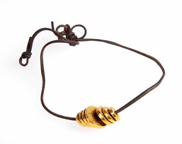 Pomellato - girocollo con sette dischi di oro puro e laccio in caucci  - Asta Fine Jewels and Watches - Associazione Nazionale - Case d'Asta italiane