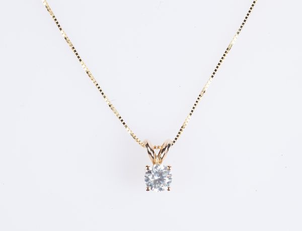 Pendente punto luce in oro e brillante  - Asta Fine Jewels and Watches - Associazione Nazionale - Case d'Asta italiane