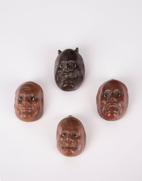 Quattro piccole maschere Kabuto. Giappone, fine secolo XIX  - Asta Arte orientale - Associazione Nazionale - Case d'Asta italiane