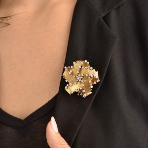 bulgari : BULGARI SPILLA A FORMA DI GIRANDOLA CON DIAMANTI  - Asta Gioielli - Associazione Nazionale - Case d'Asta italiane