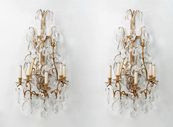 Coppia di appliques in bronzo dorato e cristallo. Francia secolo XX  - Asta Arredi Antichi - Associazione Nazionale - Case d'Asta italiane