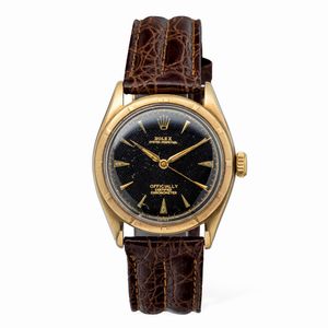 ROLEX - Elegante Oyster Perpetual ref 6085 in oro giallo 18k, quadrante nero Guilloch con indici triangolari e a bastone, fondello a vite movimento automatico