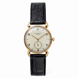 PATEK PHILIPPE - Elegante Calatrava Tear Drop ref 590, anse a goccia in oro giallo 18k, secondi al sei, numeri pari Arabi applicati