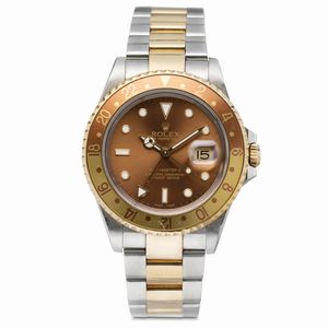 ROLEX - Intrigante GMT Master II ref 16713 Occhio di Tigre in acciaio e oro con ghiera girevole bicolore, doppio fuso orario, quadrante Brown e bracciale Oyster