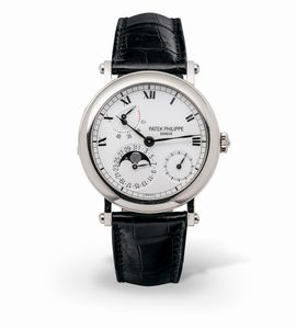 PATEK PHILIPPE - Complicato e classico Calatrava ref 5054 G in oro bianco 18k in perfetto stato di conservazione con cassa a cerniera e fondo a vista, calendario con fasi lunari, quadrante bianco smaltato e numeri Romani, con scatola e garanzia originale