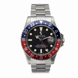 ROLEX - Iconico e sportivo GMT Master Pepsi ref 1675 in acciaio inossidabile quadrante nero opaco con pallettoni al trizio ghiera bicolore con doppio fuso orario Storia colori Pepsi