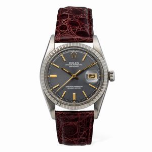 ROLEX - Semplice ed elegante Datejust ref 1603 in acciaio con ghiera godronata, quadrante grigio antracite con indici dorati, movimento automatico e datario