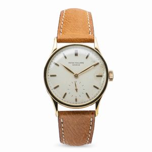 PATEK PHILIPPE - Elegante Calatrava ref 570 J, in oro giallo 18k, quadrante Argent con indici applicati e secondi al sei, accompagnato da estratto d'archivio