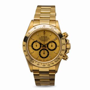 ROLEX - Iconico e pregevole Cosmograph Daytona ref 16528 in oro giallo 18k con quadrante champagne e contatori a contrasto neri