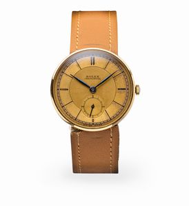 ROLEX - Attraente orologio da polso ref 3129 con quadrante a settori bitonale, cassa a disco volante in oro giallo 18k