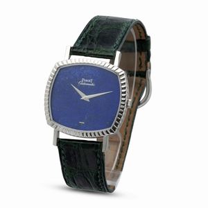 Piaget : Fine ed elegante orologio di forma a cuscino automatico con quadrante in pietra Lapis Lazuli, ghiera e carrure zigrinata  - Asta Orologi da Polso e da Tasca - Associazione Nazionale - Case d'Asta italiane